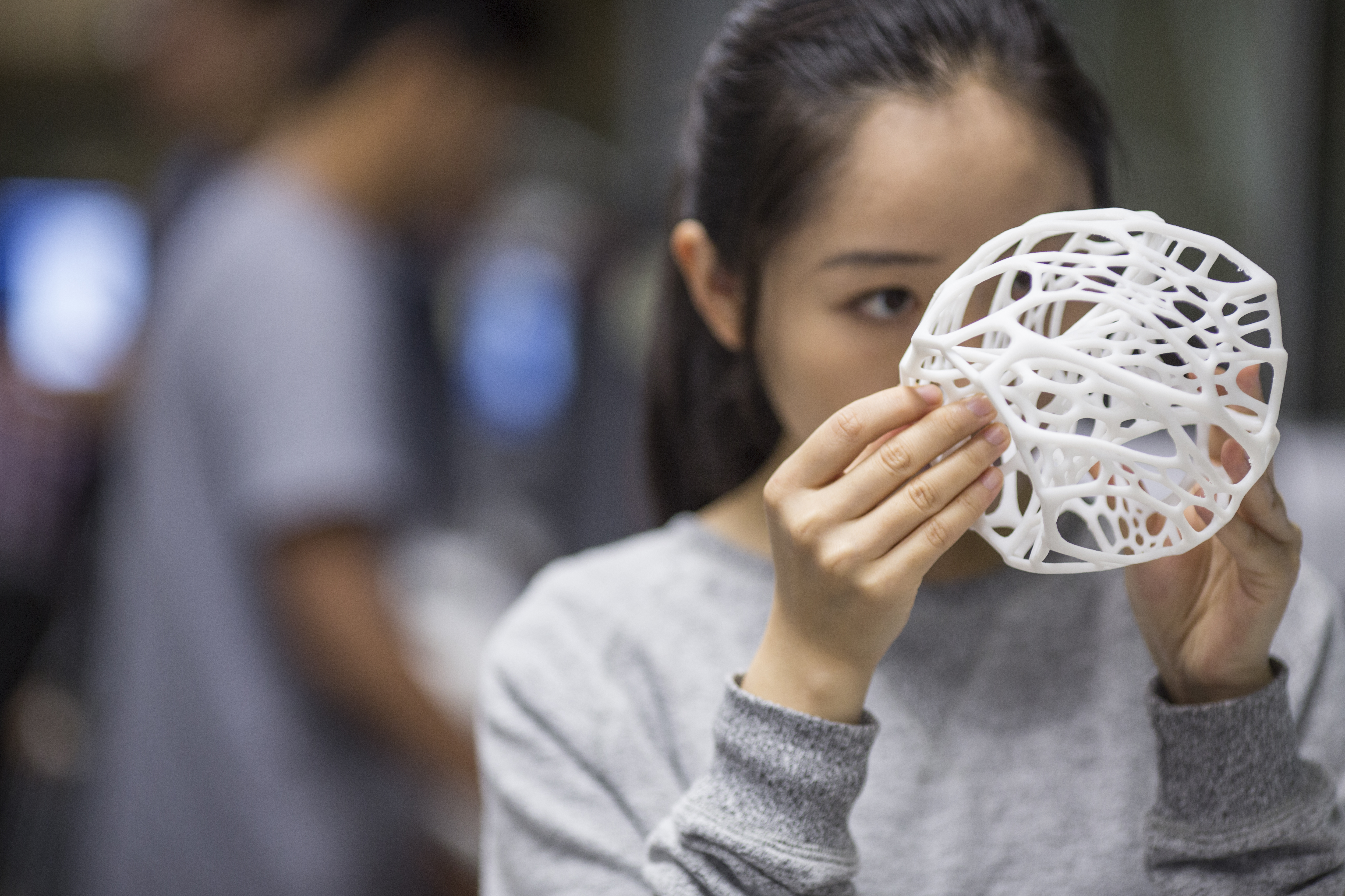 DAB student holding project in her hands