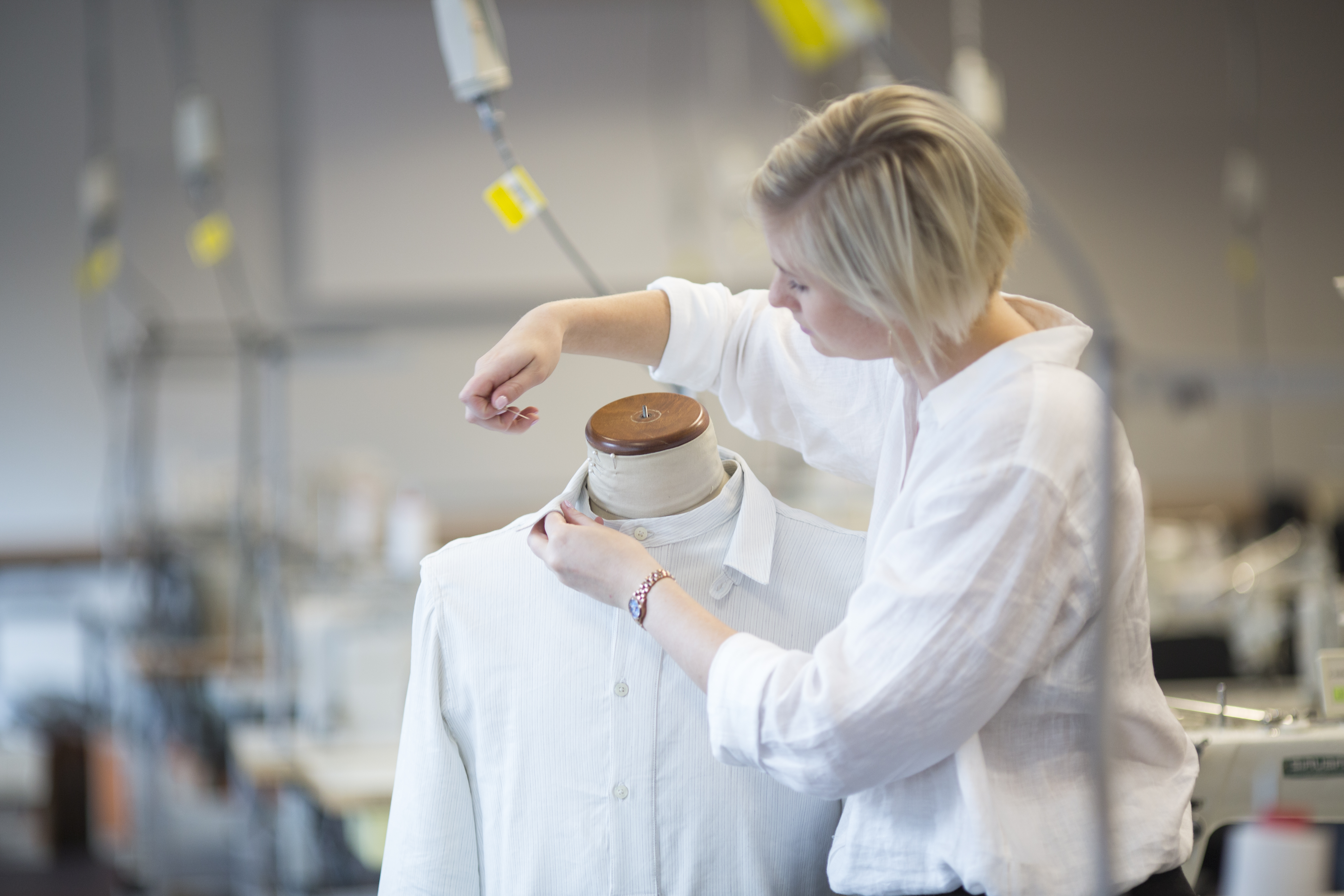 Fashion student with chosen outfit and knitting needle 