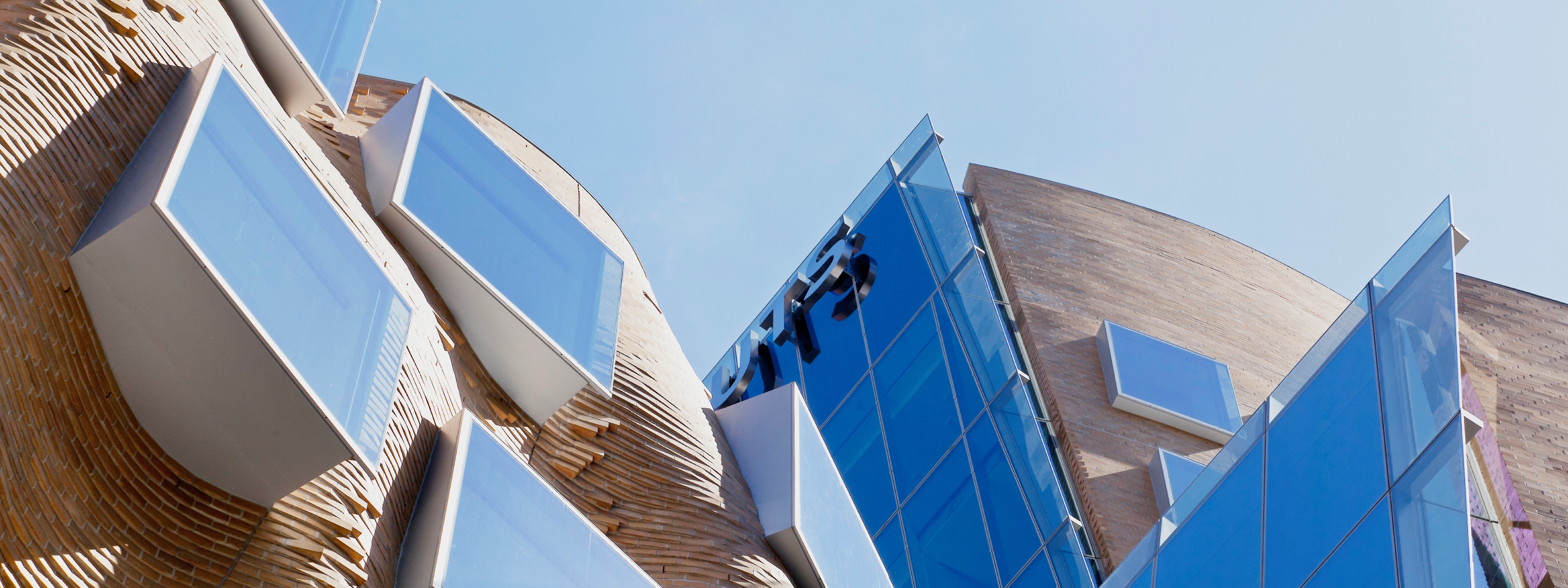 Looking up at UTS Business School building and sky