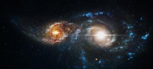 Two galaxies are merging together. 