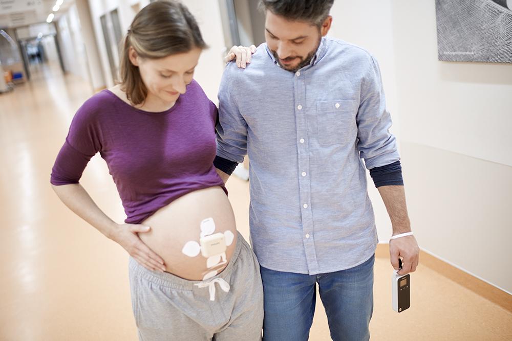 Mother with Avalon fetal monitoring and partner