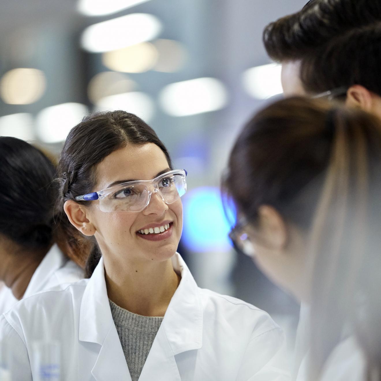 UTS students discussing research in a lab