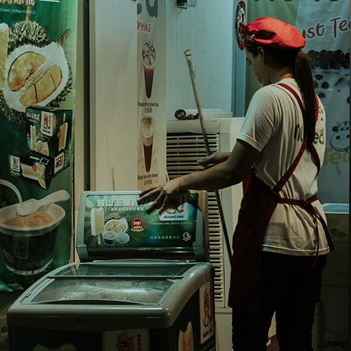 Woman cleaning out the back of a restaurant.