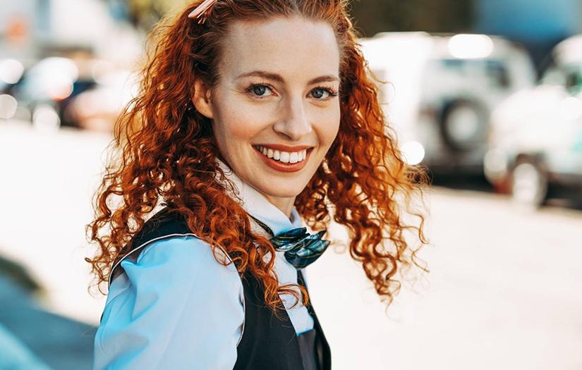 Young girl smiling and looking at the camera