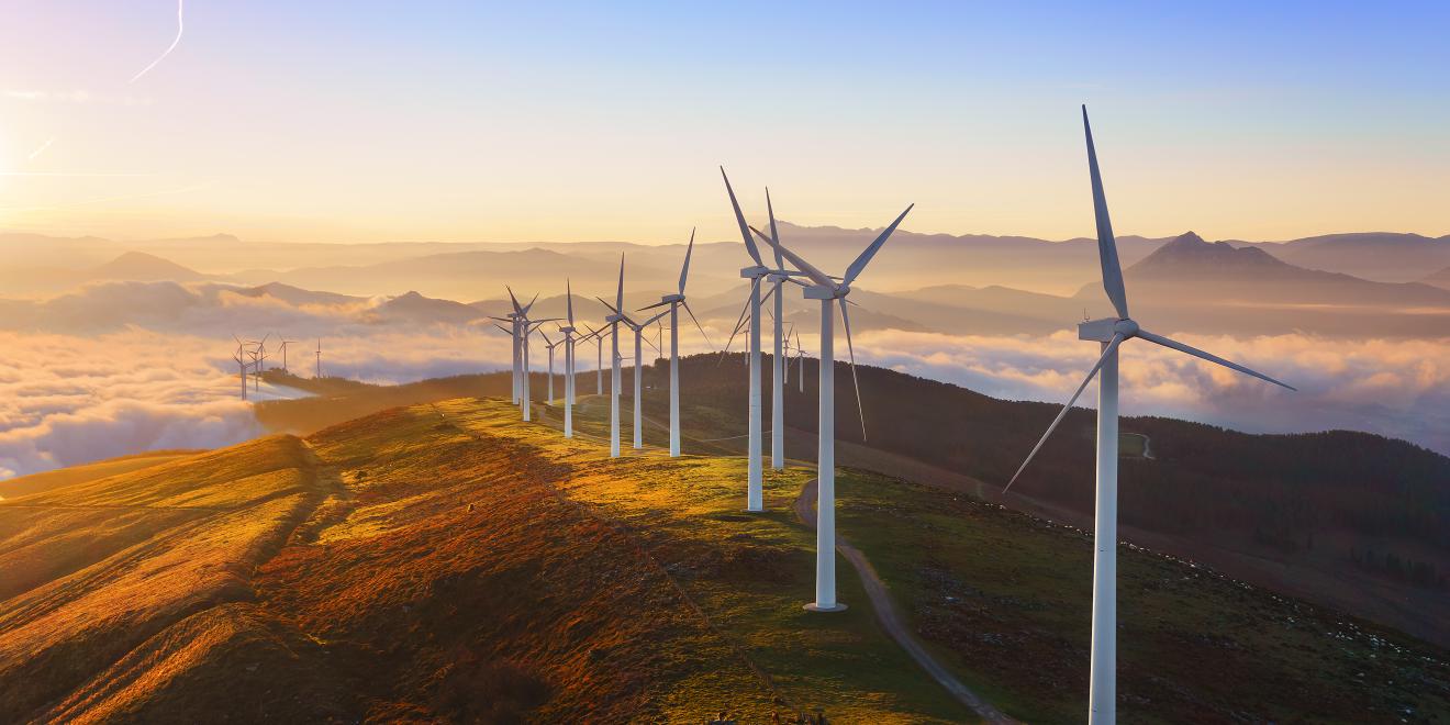 Wind turbines on hilltop.