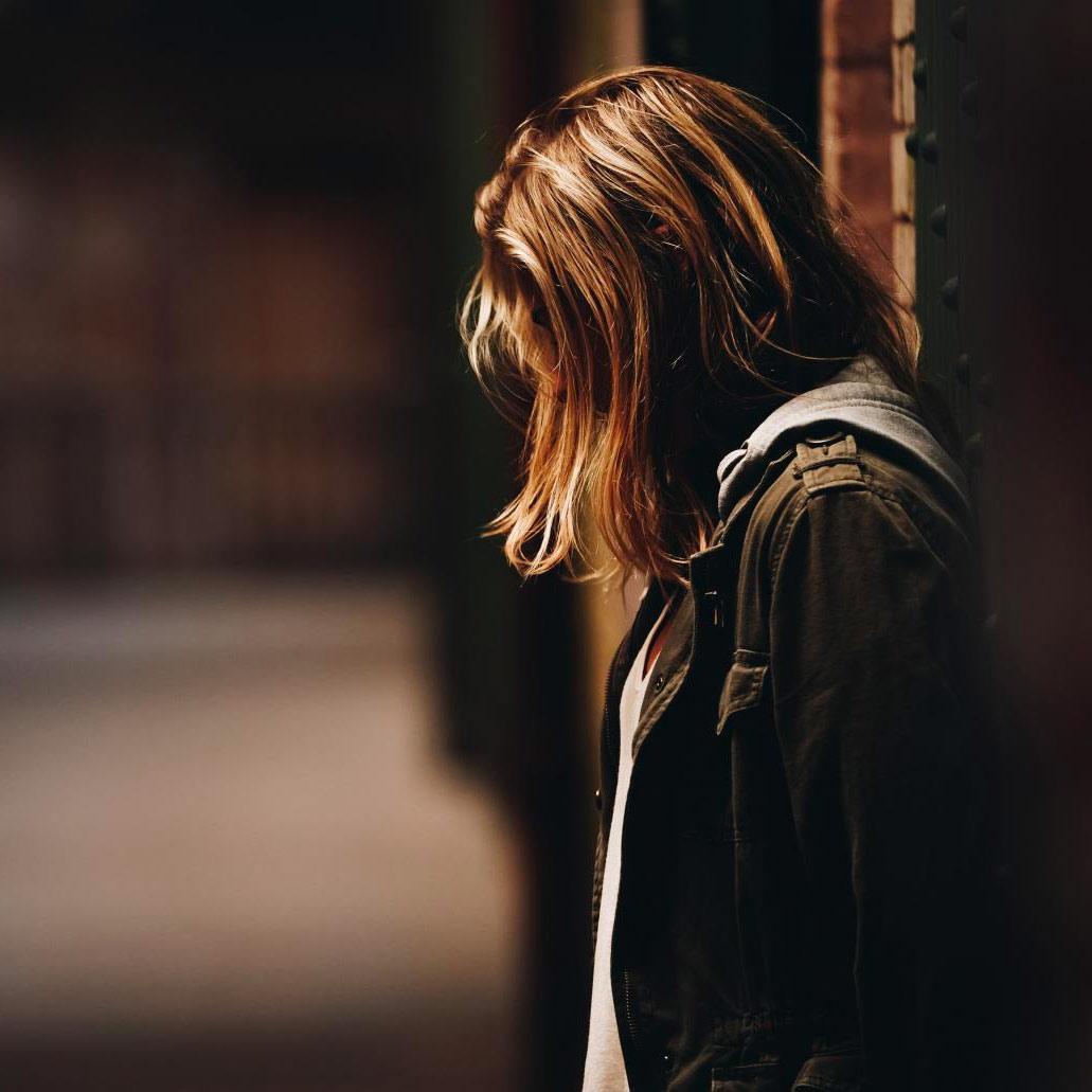 woman in alleyway