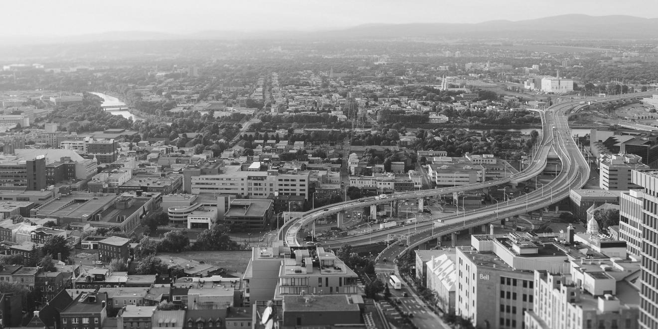 Black and white image of buildings and roads.
