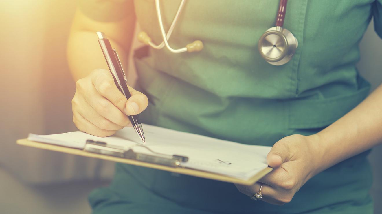 Health nurse with pen and clipboard