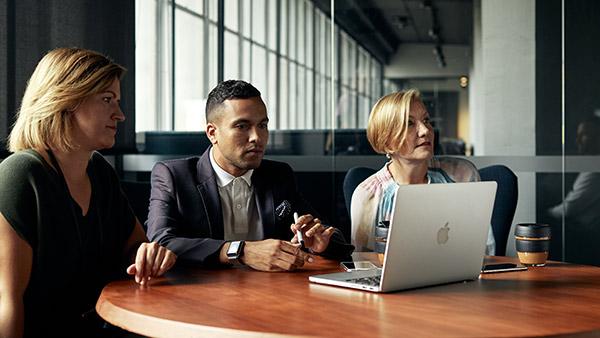 three students with laptop