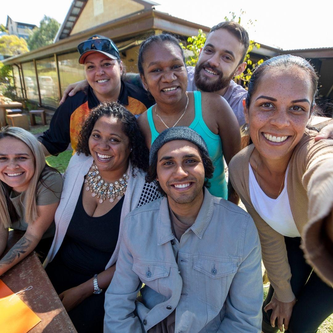 A group of people smiling