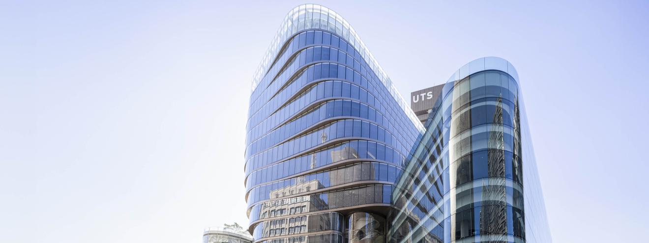 View looking up at UTS campus buildings with UTS Tower in the background