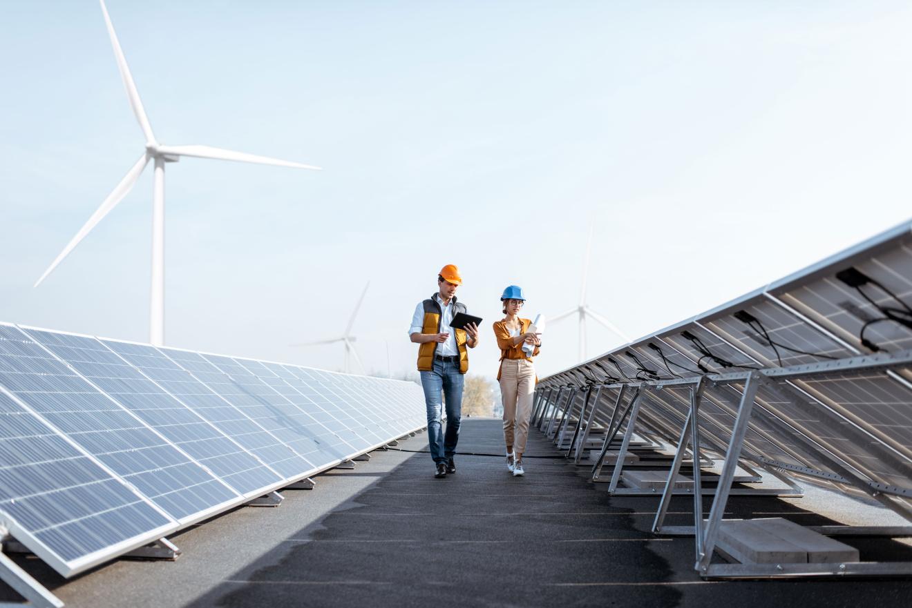 workers on solar & wind turbine site