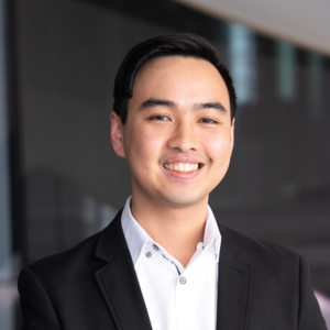 David Hua, short black hair, male, black suit jacket with a white shirt underneath