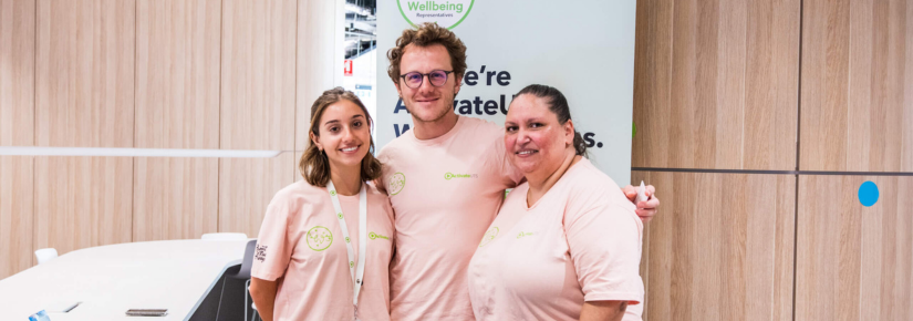 3 people standing together in pink shirts