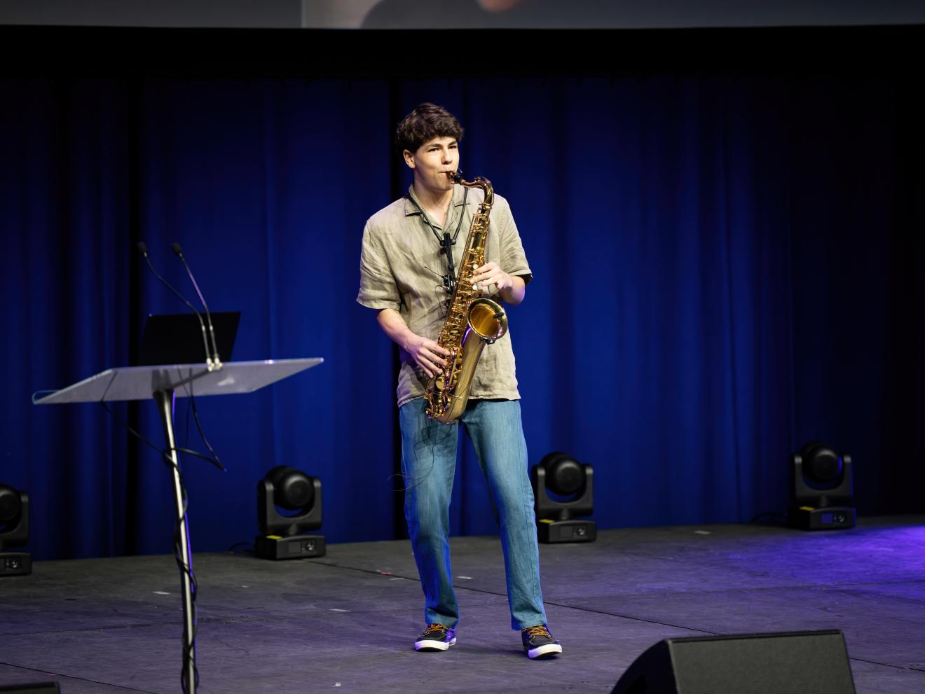 Jesaiah Creek, founder of SaxApp playing the sax at the UTS Startups Summit 2024