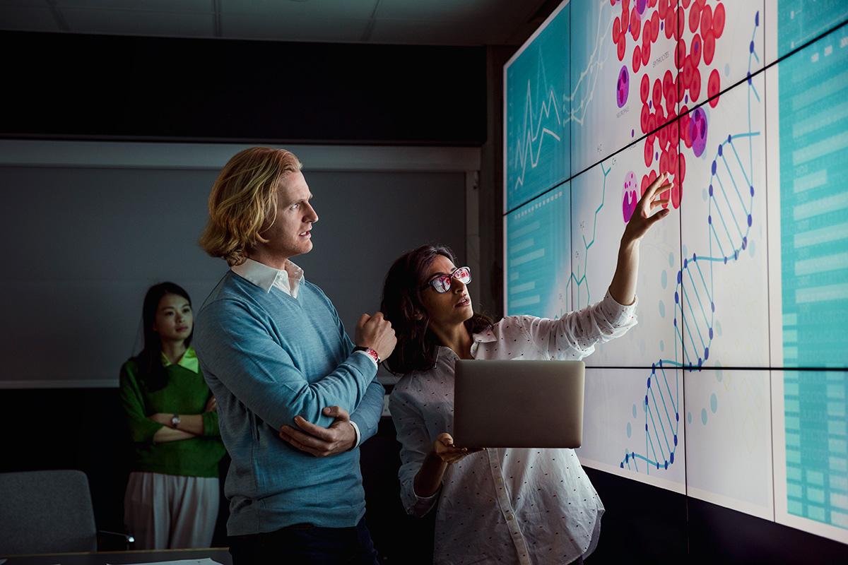 2 people looking at visual