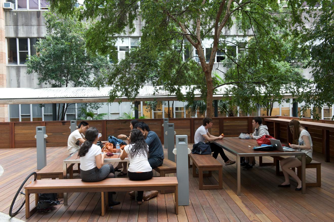 students chilling in building 5 courtyard