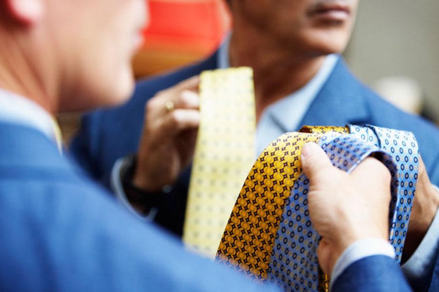 Man choosing a tie Man choosing a tie