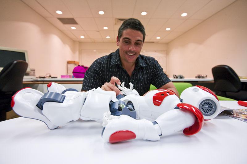 Research student with robot