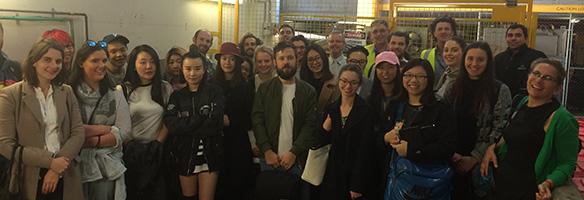 Dr Dena Fam with Facilities Management staff, design students and cleaners visiting the organics processing system in the basement of building 10.