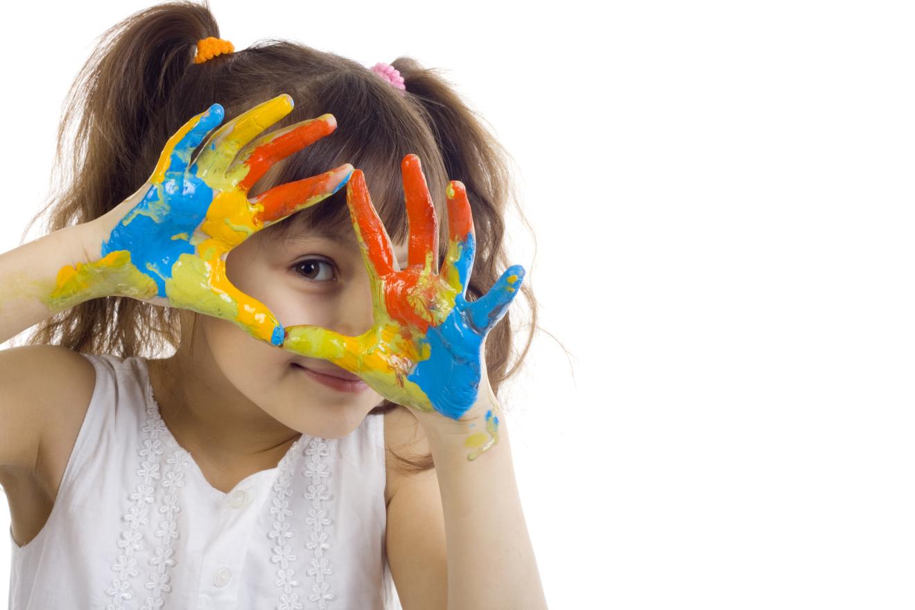 Preschool aged child with paint on her hands