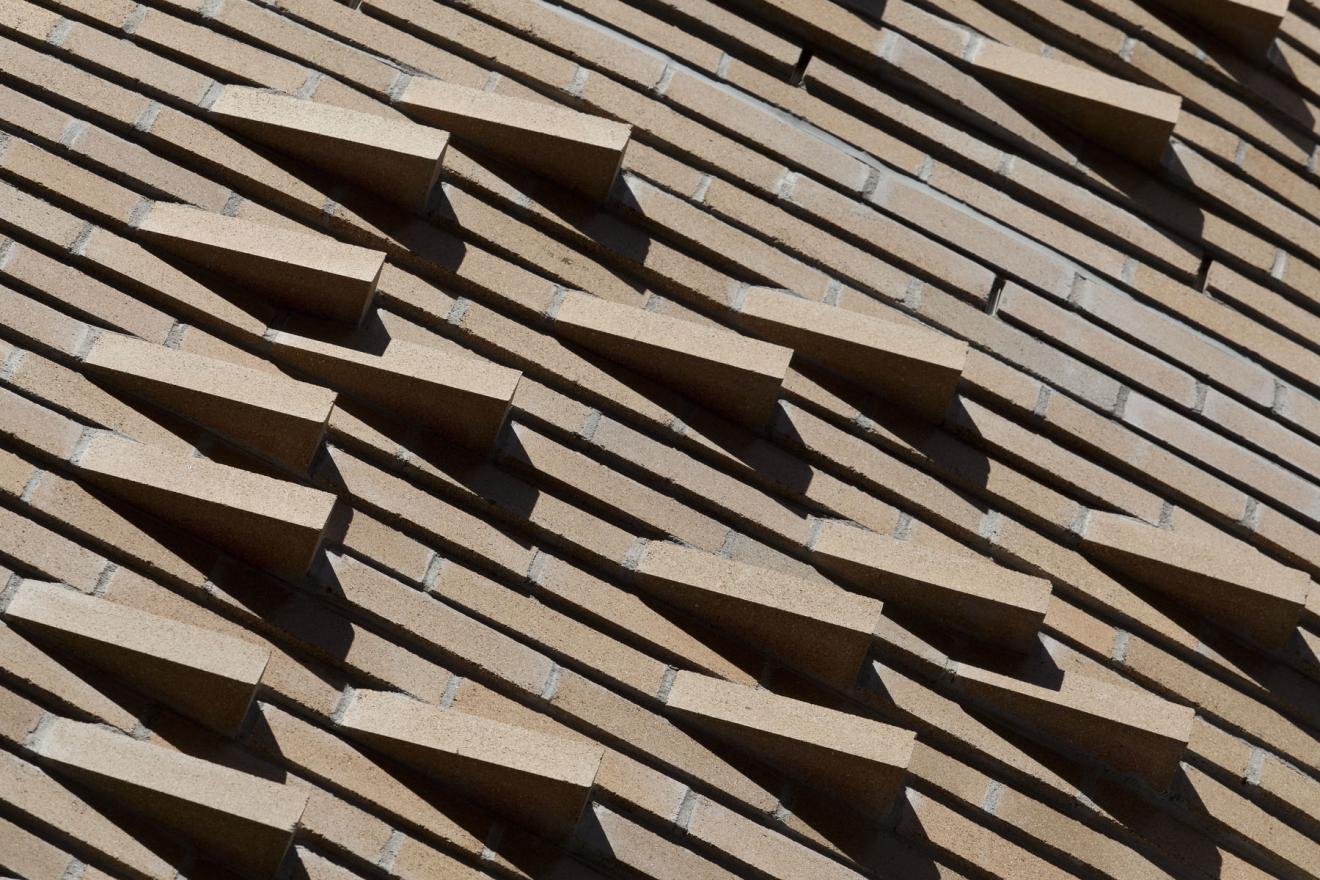 Detail photo of 'k-bricks' and undulating brickwork.