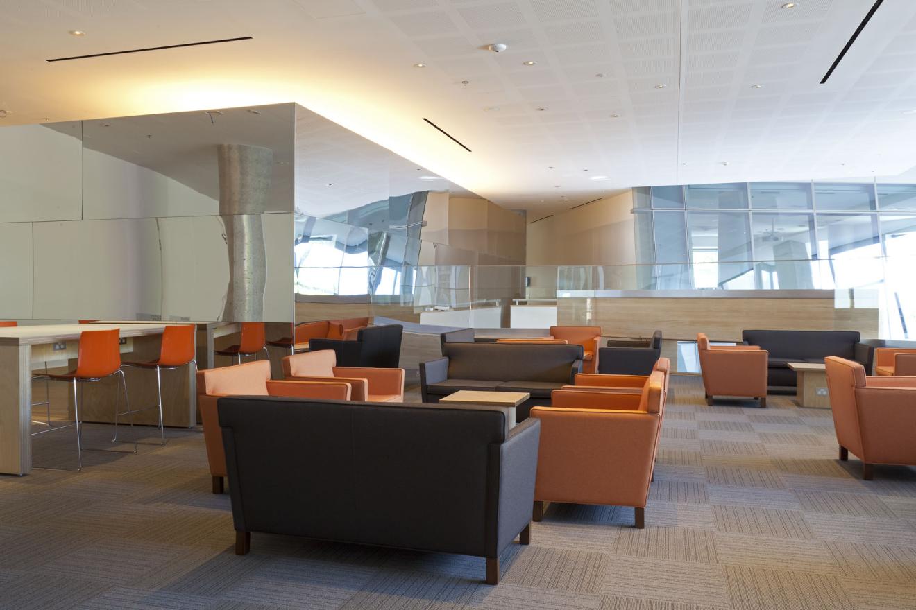 The graduate lounges on level four feature informal student seating to relax, study and connect. There is a well equipped kitchen and many power point plugs available for student convenience.