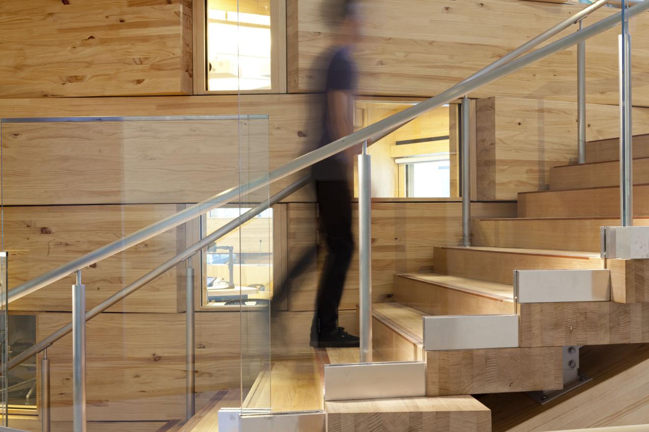 Stair K wraps around the oval classroom on level 3 to the student lounge above on level 4. It is made of Victorian ash. 