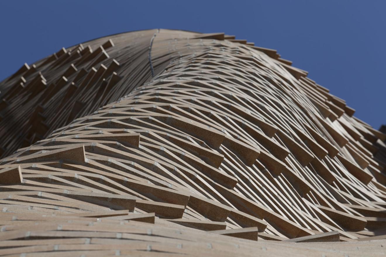 Detail photo of the undulating brick of the Dr Chau Chak Wing Building