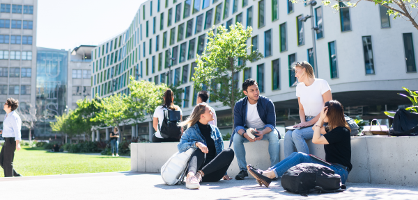 Students sitting on the Alumni Green