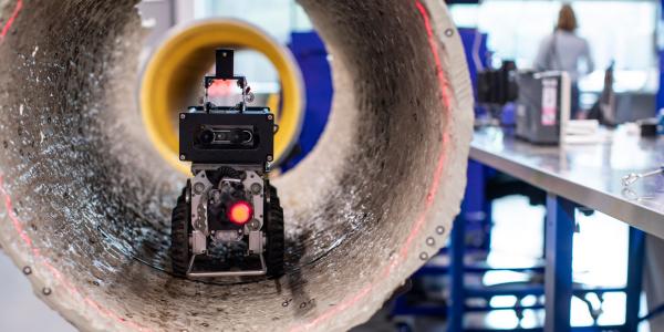 Testing the robot sensors in a concrete pipe in Tech Lab