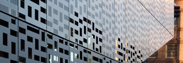 blue grey detail of the facade of the UTS Engineering and IT building at dusk