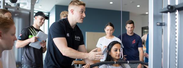 UTS teaching students in a gym setting