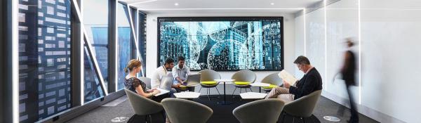 A group of people working in the UTS Data Lounge