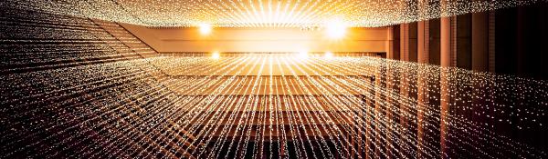 Looking up at a golden roof with radiating strings of fairy lights coming downwards