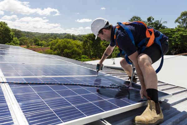 Man installing solar panels