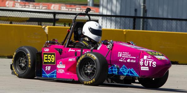 The UTS Motorsports vehicle in a time trial race