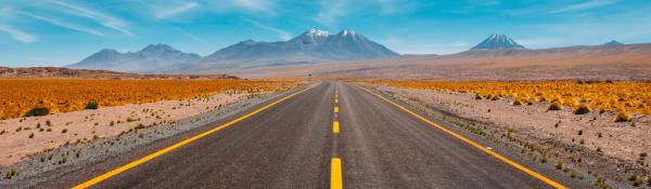 two-lane highway traversing a desert