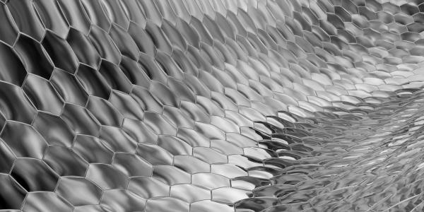 Greyscale geometric hexagonal pattern curving into the distance