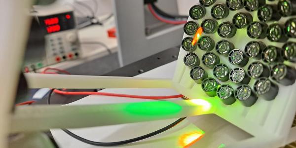 An array of ultrasound speakers levitating a bee's leg