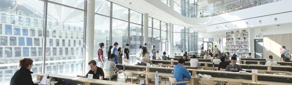 Students enjoying the brightly lit UTS library reading room
