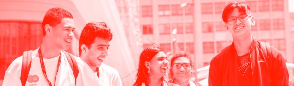 High school students smiling and laughing on the UTS campus.