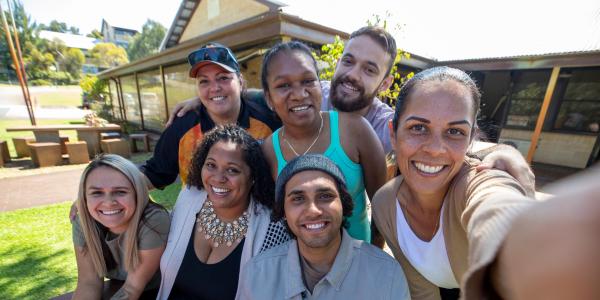 A group of people smiling