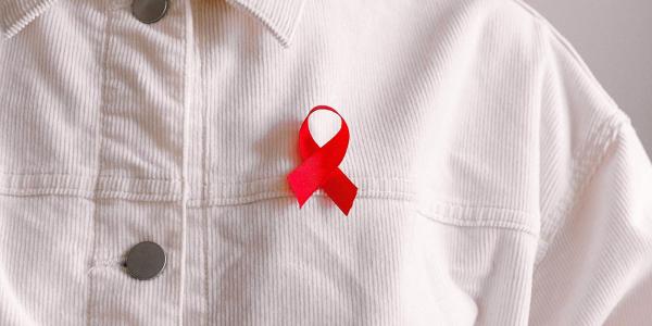 red ribbon on white shirt