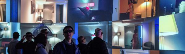 People watching the multiscreens in the UTS Data Arena