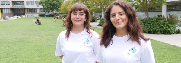 Two UTS students with t-shirts promoting academic integrity outside UTS Alumni Green