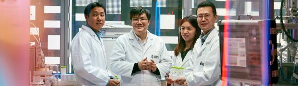 Four CEE Researchers standing together in their lab