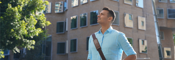 Akash standing outside Business school 