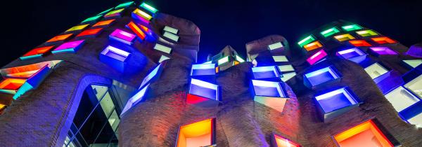 Dr Chau Chak Wing Building 8 with rainbow coloured lighting windows.