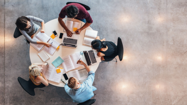 800x450 Top view of group of people sitting together at table.png